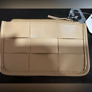 NWT little tan wallet, has zipper pocket and 6 slots for cards